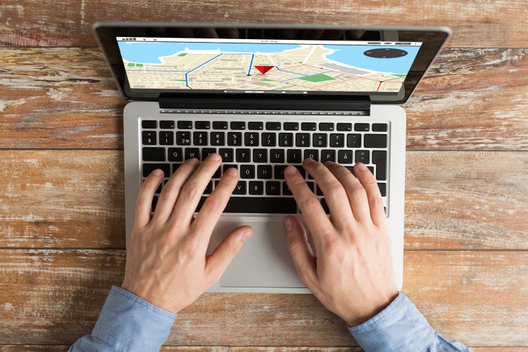 Laptop showing a local map for business search and navigation