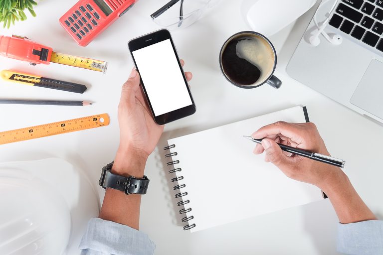 Small business owner planning social media on a phone