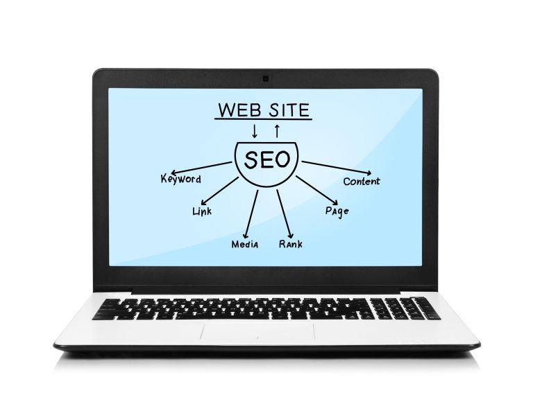 Laptop with SEO planning notes for a website redirect strategy