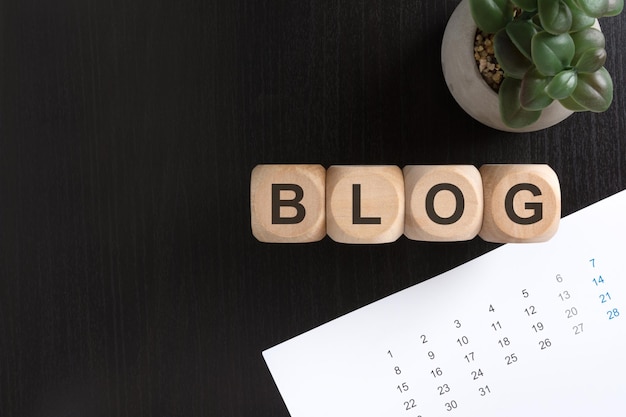 Business blog content calendar and article notes on a desk