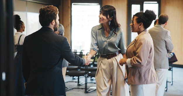 Business people shaking hands at a networking event