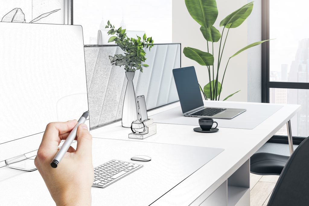 Designer sketching a website plan on paper