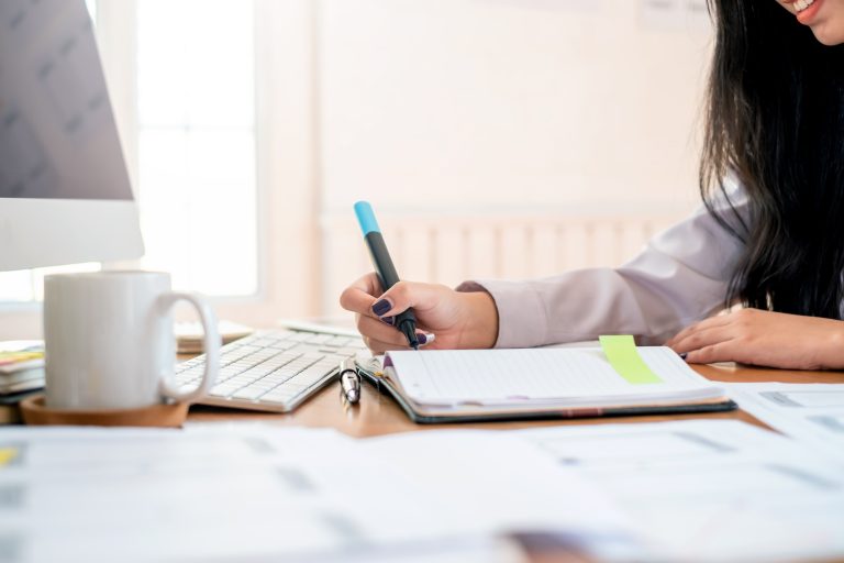 Designer sketching a website outline and planning page content