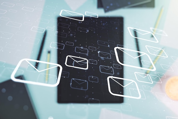 Email notification icons over a digital tablet