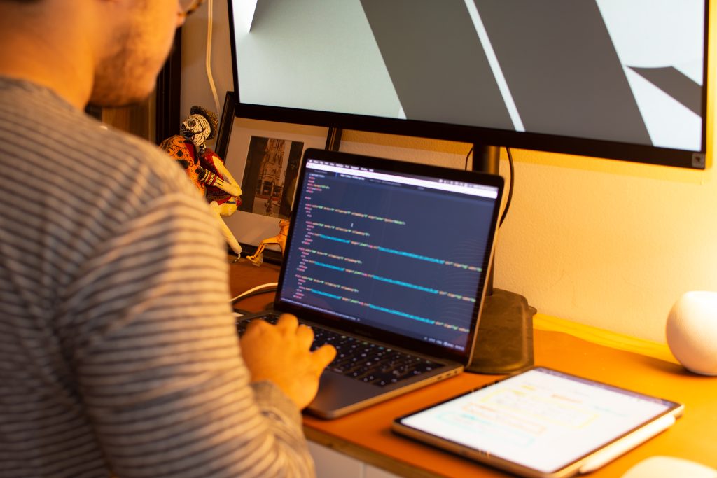 Web developer comparing mobile and desktop versions of a website
