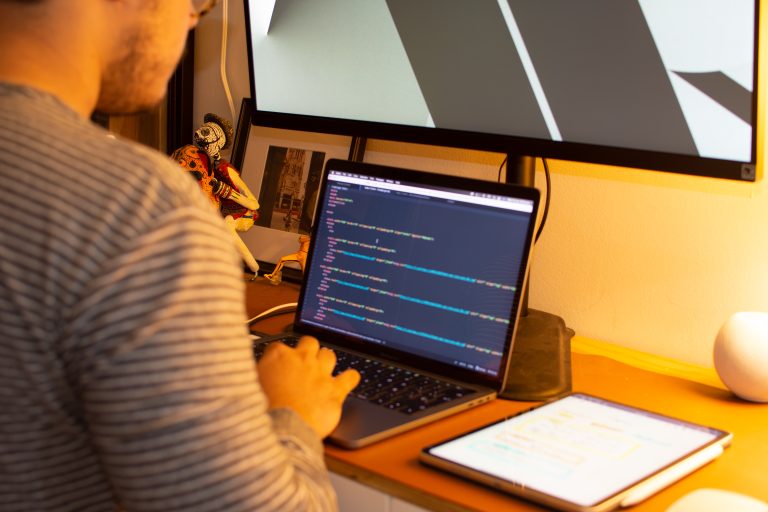 Web developer comparing mobile and desktop versions of a website