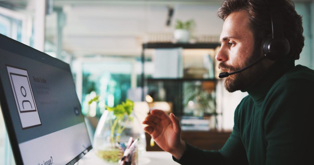Customer support agent wearing a headset helping website visitors