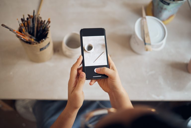 Small business owner taking a photo for social media