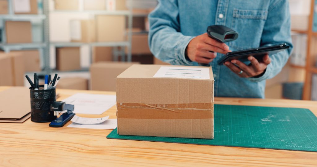 Ecommerce order being checked with a tablet and barcode scanner