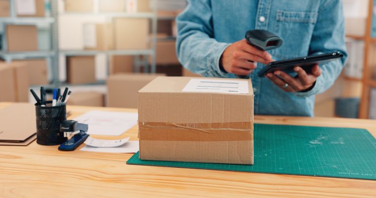 Ecommerce order being checked with a tablet and barcode scanner