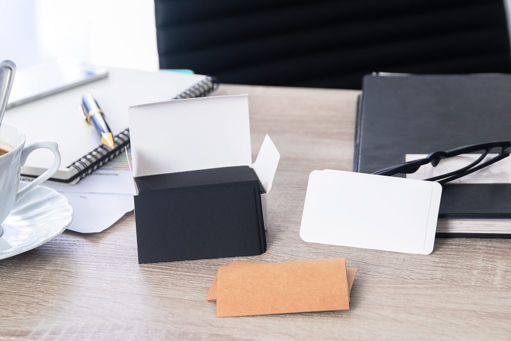 Branding stationery and business cards arranged on a desk