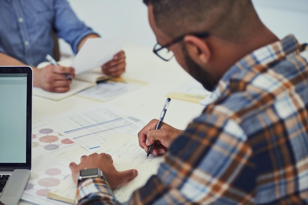 Web designer and client reviewing a project plan together
