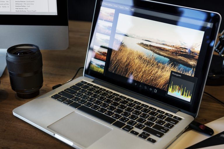 Camera and design workspace representing website image optimisation