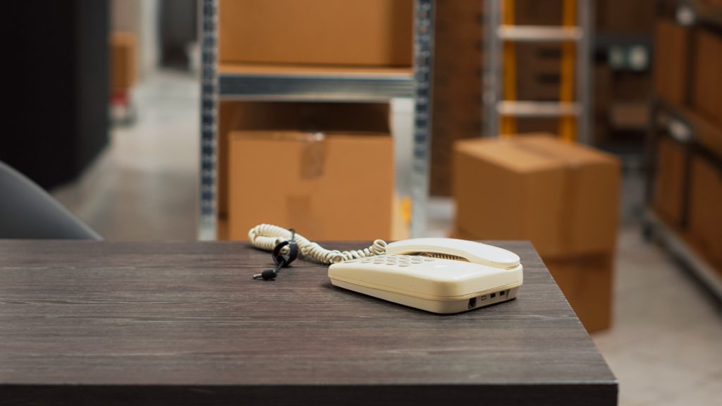 Warehouse shelves with packaged ecommerce orders ready for dispatch