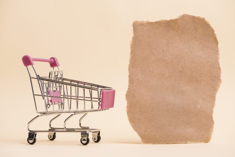 Empty miniature shopping trolley representing basket abandonment