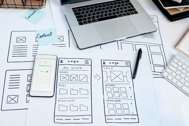 Designer reviewing website inspiration and wireframe ideas