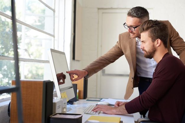 Web designer discussing hosting and website support with a client
