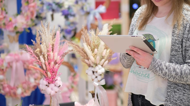 Small business owner selling flowers at a local market