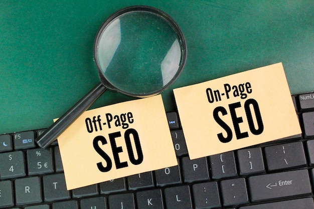 On-page and off-page SEO notes beside a magnifying glass