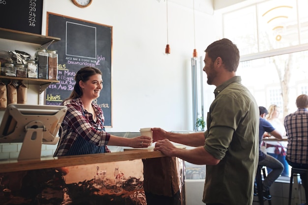 Regular customer being served at a cafe counter