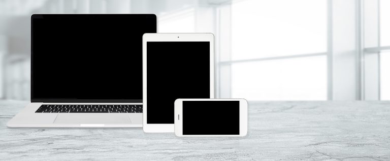 Laptop, tablet, and smartphone showing a responsive website layout