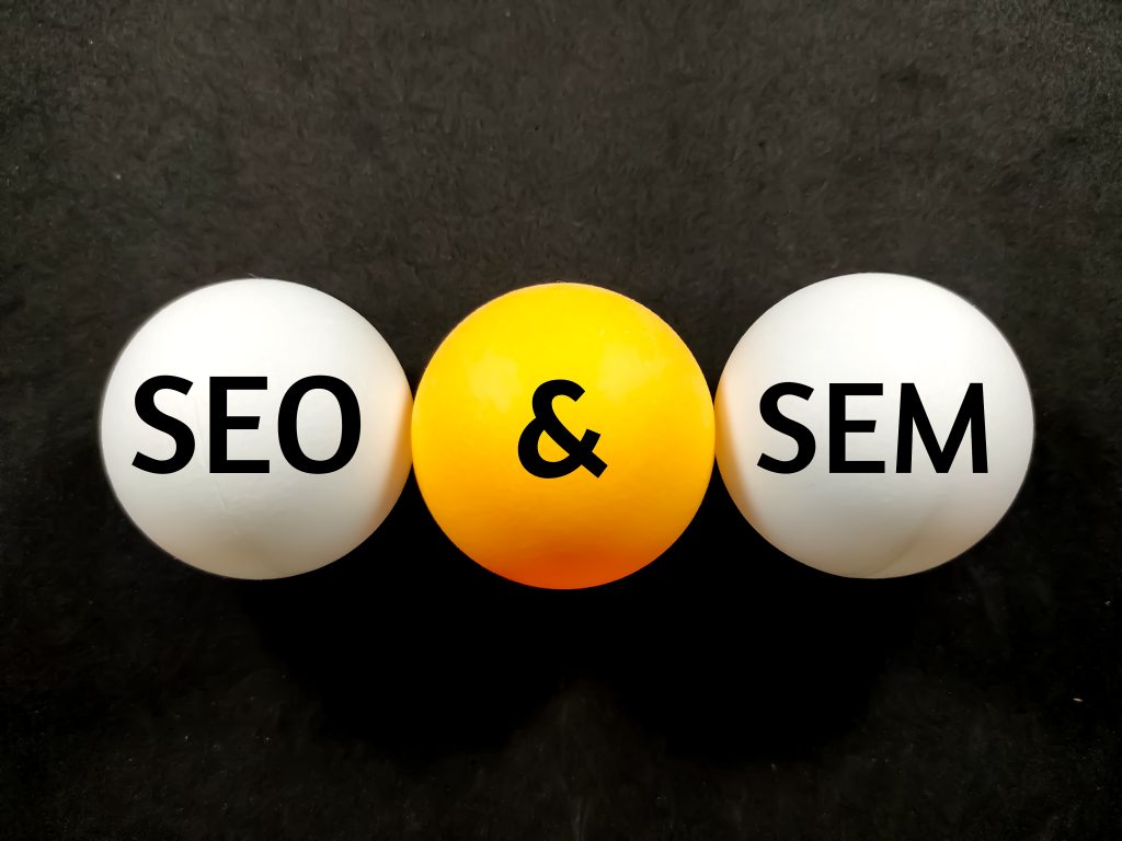SEO and SEM words representing organic and paid search marketing