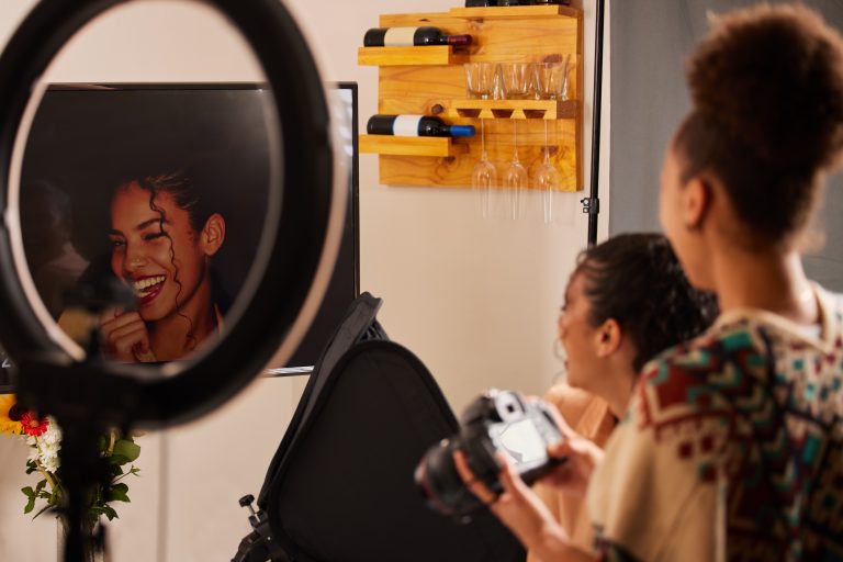 Photographer and influencer reviewing images during a creative shoot