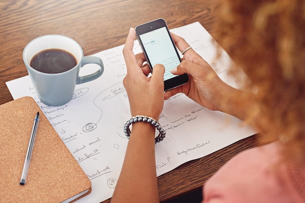 Hands using a phone for social media and email communication