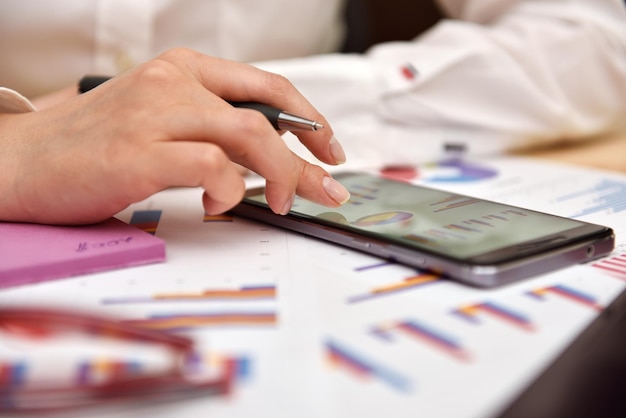 Phone showing business report data for productivity planning