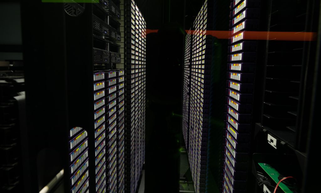 Rows of server racks in a modern data centre
