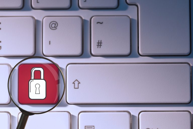 Keyboard key protected by a padlock representing domain privacy