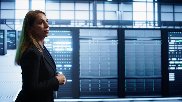 Technician checking equipment in a server room