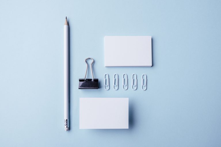 White stationery and business cards on a desk
