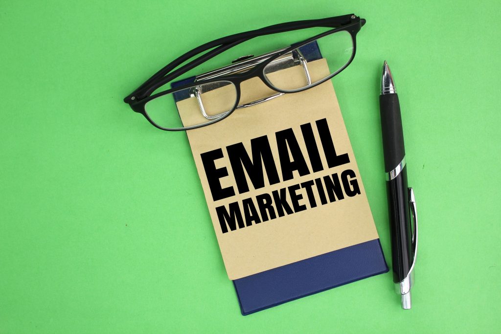 Notebook with email marketing written on it