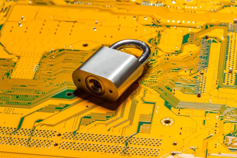 Padlock on a computer circuit board representing website malware protection