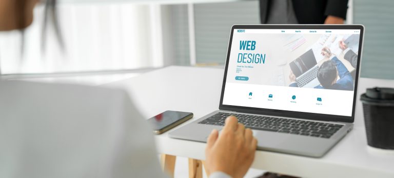 Website design software on a laptop for building a business website